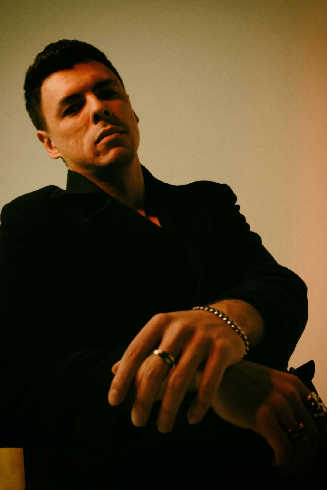 Studio portrait of a 45 year old white male film actor in a dark tailored blazer