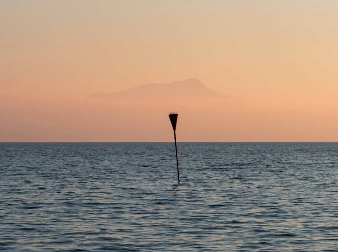 Panoramic view of Lake Geneva with the Swiss Alps in the background at golden hour